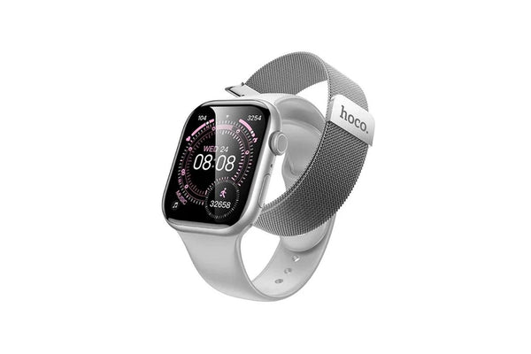 A silver smartwatch with a rectangular black display showing a digital watch face, paired with a gray mesh loop band. The band has a silver metal tip with the brand name 'hoco.